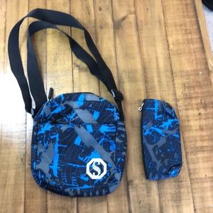 Black and blue lunchbox with black and blue pencil pouch.